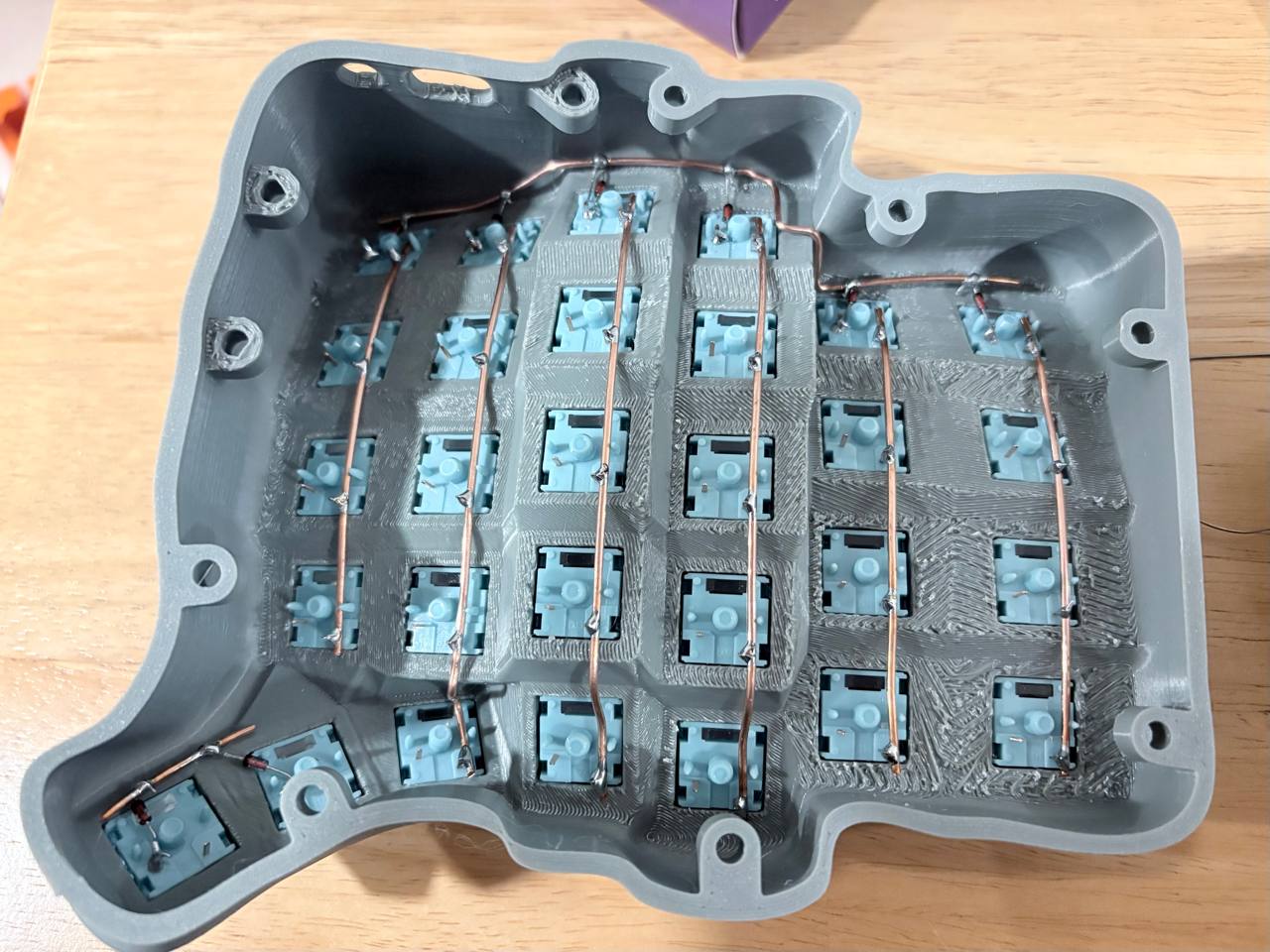 Wiring up the top and bottom row with copper wire